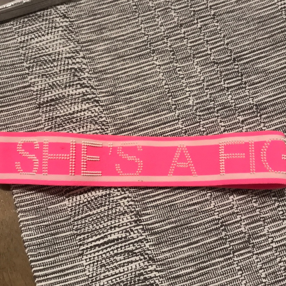 Under armor headband saying she’s a fighter